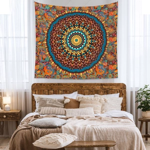 Detail view of Bohemian mandala tapestry with blue and yellow patterns in a bedroom setting