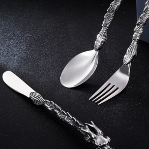Punk style stainless steel cutlery set with detailed dragon handle carving