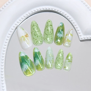 Cat eye green floral press on nails with hand-painted daisy art and 3D glitter finish