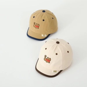 Detail of baby baseball caps with cute puppy embroidery and soft brim in cotton fabric