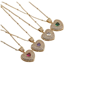 Detail of copper zircon heart necklaces in green, white, purple, and red gemstones