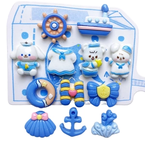 13-piece blue nautical resin charms set featuring sailors boats anchors and lifebuoys