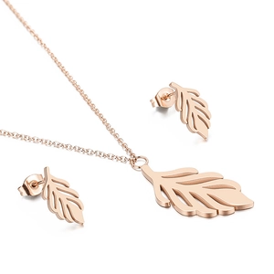 Elegant rose gold hollow leaf jewelry set with necklace and stud earrings on white background
