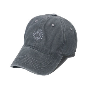 Detail of vintage washed charcoal grey baseball cap with sun embroidery and stitching