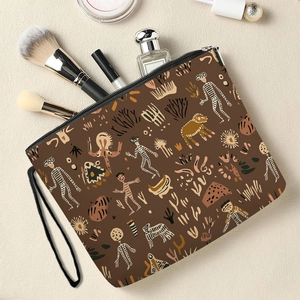 Abstract camel print makeup bag with zipper and hand strap, showing internal storage capacity