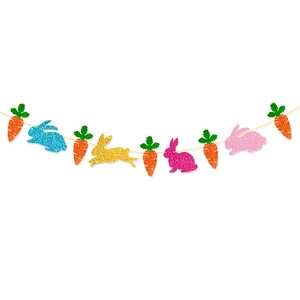 Detail of glitter rabbit and carrot banner decorations for Easter party backdrop