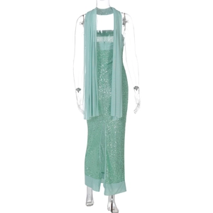 Detail of light green sequined strapless maxi dress with matching transparent shawl