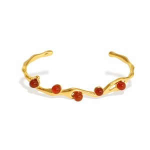 Retro stainless steel open bangle with five red agate stones and gold polished finish
