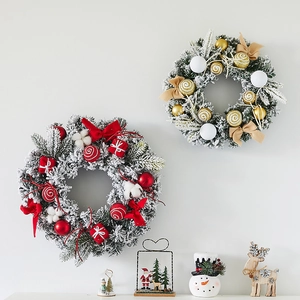 Elegant Christmas wreaths with pine cones and bows hanging on a wall for festive home decor