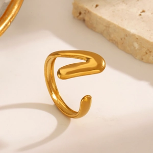18K gold plated V-shaped open ring made of stainless steel on minimalist stone base