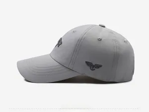 Side view detail of grey quick-dry baseball cap with 3D embroidery and breathable mesh holes
