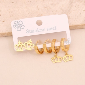 Three pairs of golden stainless steel earrings set featuring crown studs and hoops