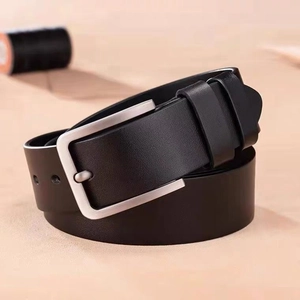 Classic men's black leather belt with silver prong buckle in a coiled display