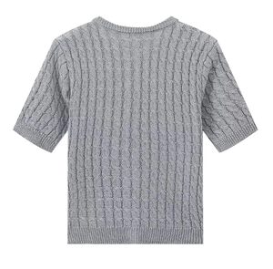 Close-up of grey cable knit texture on a slim fit crew neck short sleeve cardigan