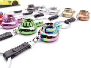 Macro shot of colorful turbocharger keychain details with metallic finish and leather strap