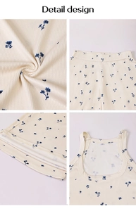 Détails du tissu en maille côtelée beige à fleurs bleues avec des finitions soignées