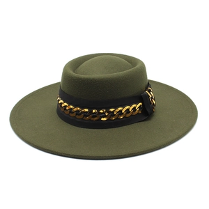 Detailed view of an olive green felt fedora hat with a black band and gold chain decoration