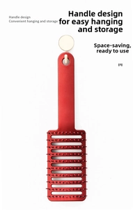 Close-up of red vented hairbrush with ergonomic handle and hanging hole for easy storage