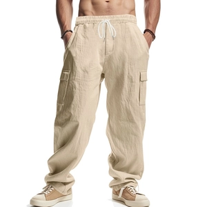 Men's beige cargo trousers with drawstring waist and large side pockets in a loose fit