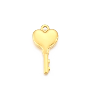 Macro view of gold heart-shaped key pendant with polished finish and hollow design