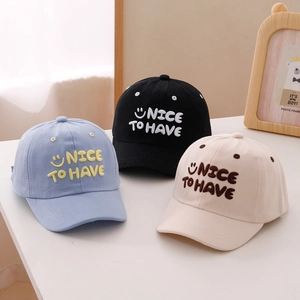 Detailed towel embroidery and smile pattern on cotton baseball caps for children