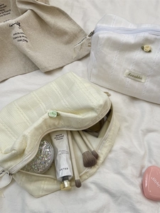 Floral makeup bag set in cream and white fabric with elegant rose accent and lace trim