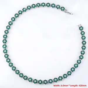 Detail of luxury emerald flower necklace with continuous floral links and crystal accents