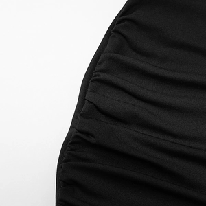 Detail of black ruched fabric texture with elastic knit folds for a bodycon dress
