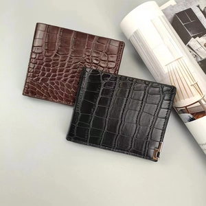 Close-up of black and dark brown crocodile pattern leather wallets for men in a business style