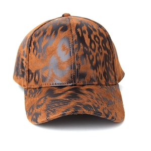 Detailed view of the textured leopard print fabric and curved brim on this baseball cap