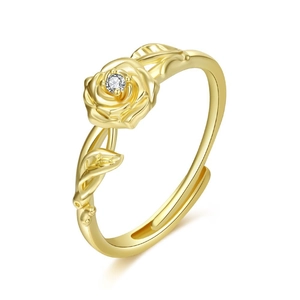 Close-up of golden adjustable rose ring with crystal center and leaf textures