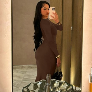 Detailed mirror selfie of a slim fit brown long sleeve ruched dress with round neck