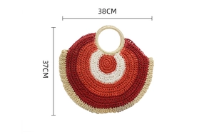 Detail view of round woven paper rope straw bag with dimensions 38cm by 37cm