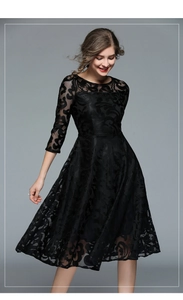Detail of elegant black lace hollow texture and 3/4 sleeves on a slim A-line dress