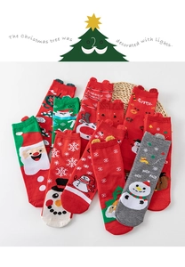 Detail of Christmas cotton socks with 3D ears and festive reindeer snowflake patterns