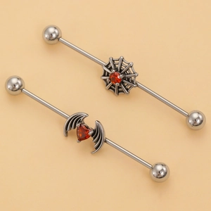 Gothic industrial barbell earrings with spider web and bat wings featuring red heart stones