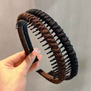 Non-slip twisted fabric headband with teeth in black and brown for high hair volume