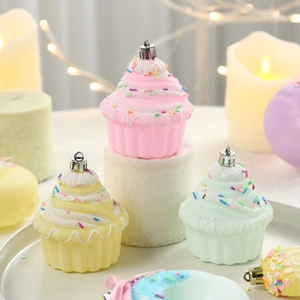 Pastel cupcake Christmas ornaments with white glitter frosting and metallic hanging loops