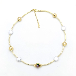 Detail showing gold beaded necklace with pearls, green and purple square gemstones
