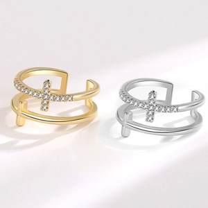 Double-layered cross ring with zircon accents in gold and silver finishes