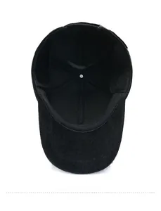 Detailed interior view of a black winter baseball cap featuring warm faux mink lining