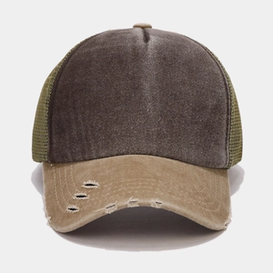 Macro detail of distressed brim and washed cotton fabric on retro trucker hat