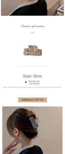 Detailed view of 8cm beige marble acetate hair claw clip with model styling