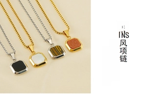 Detail view of 18K gold plated square pendants with natural stones and shell inlays