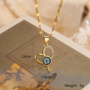 Close-up of 18K gold plated heart evil eye pendant necklace with 2.6cm x 1.4cm dimensions