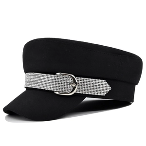 Black baker boy hat with sparkling rhinestone band and silver metallic buckle decoration