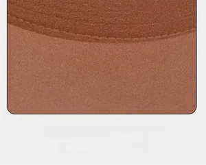 Macro shot of fine stitching on the brim of a brown wool felt flat top fedora hat