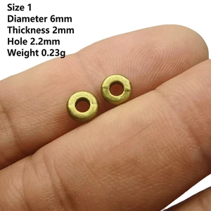 Macro shot showing 6mm antique bronze wheel spacer beads with dimensions for DIY jewelry