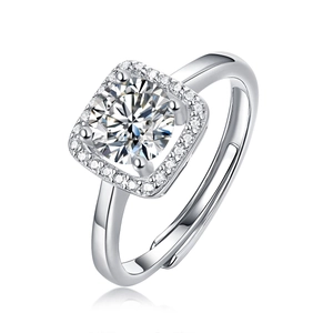 Macro shot of silver ring featuring round cut stone with square halo setting