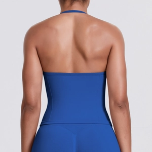 Macro detail of seamless navy blue sports tank top showing racerback and elastic fabric
